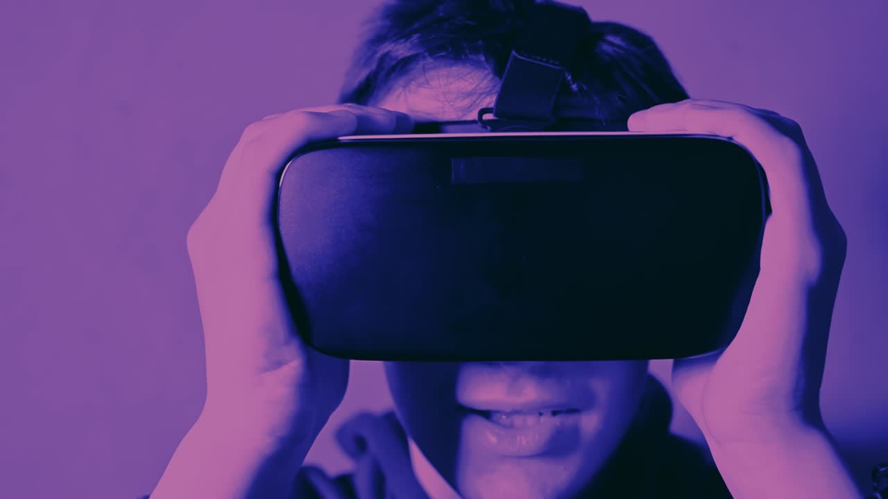 Young man smile and enjoy virtual reality head set