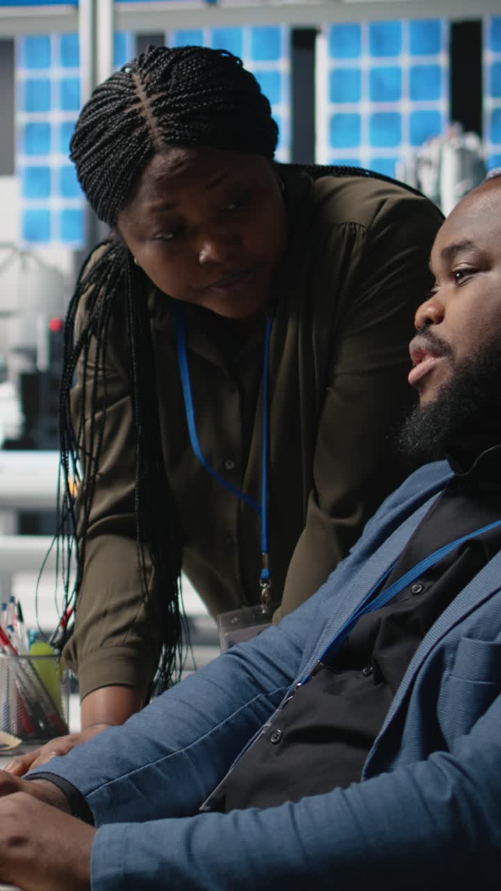 Vertical Video African american team of engineers collaborating in a solar energy facility