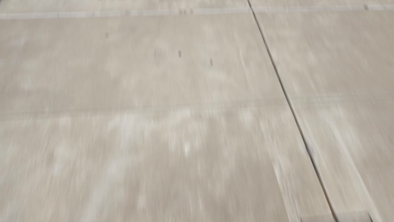 Exterior view of modern buildings with pathway and green lawn