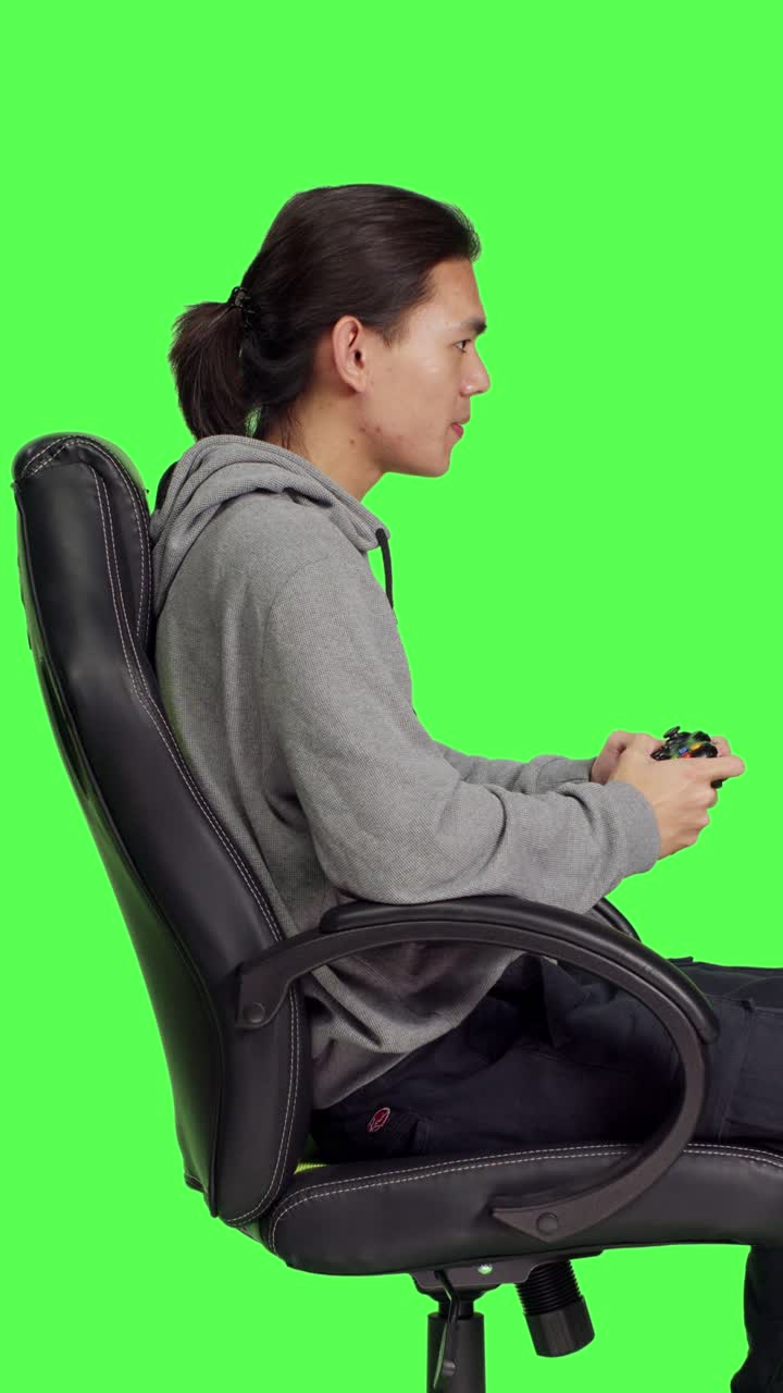 Profile of asian guy playing videogames