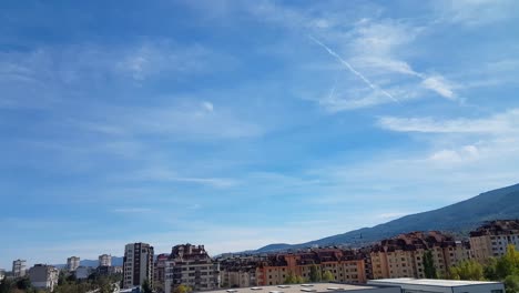 sky over the city on a sunny day with some chem trails