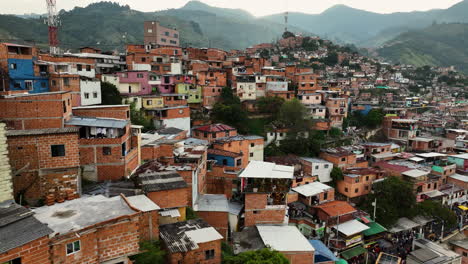 Colorful-poverty-homes-in-Favela-Comuna-13,-in-Mendellin,-Colombia---Aerial-view