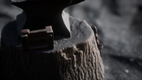 old anvil attached to a stump