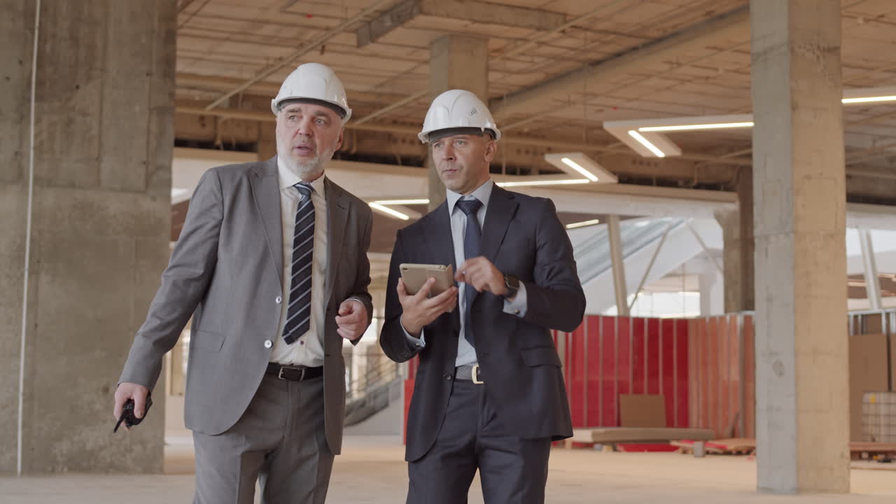 Foremen Walking Around Construction Site