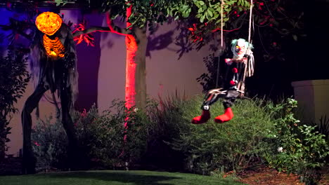 Swinging-clown-and-pumpkinhead-Halloween-decorations-and-animatronics