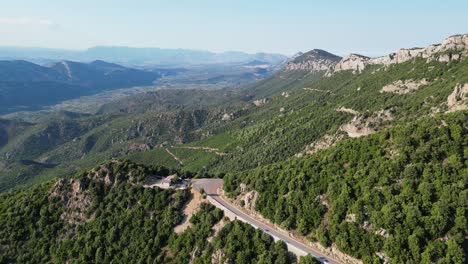 Panoramic-Winding-Road-and-Green-Mountains-in-Sardinia,-Italy---Aerial-4k