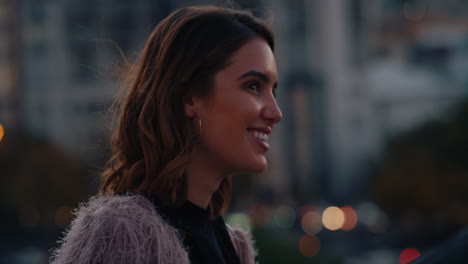 portrait beautiful young woman smiling enjoying rooftop view of city skyline at sunset relaxing on weekend