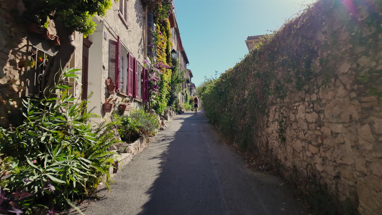 A walk on the streets of Antibes, France on a sunny day with grass and flowers