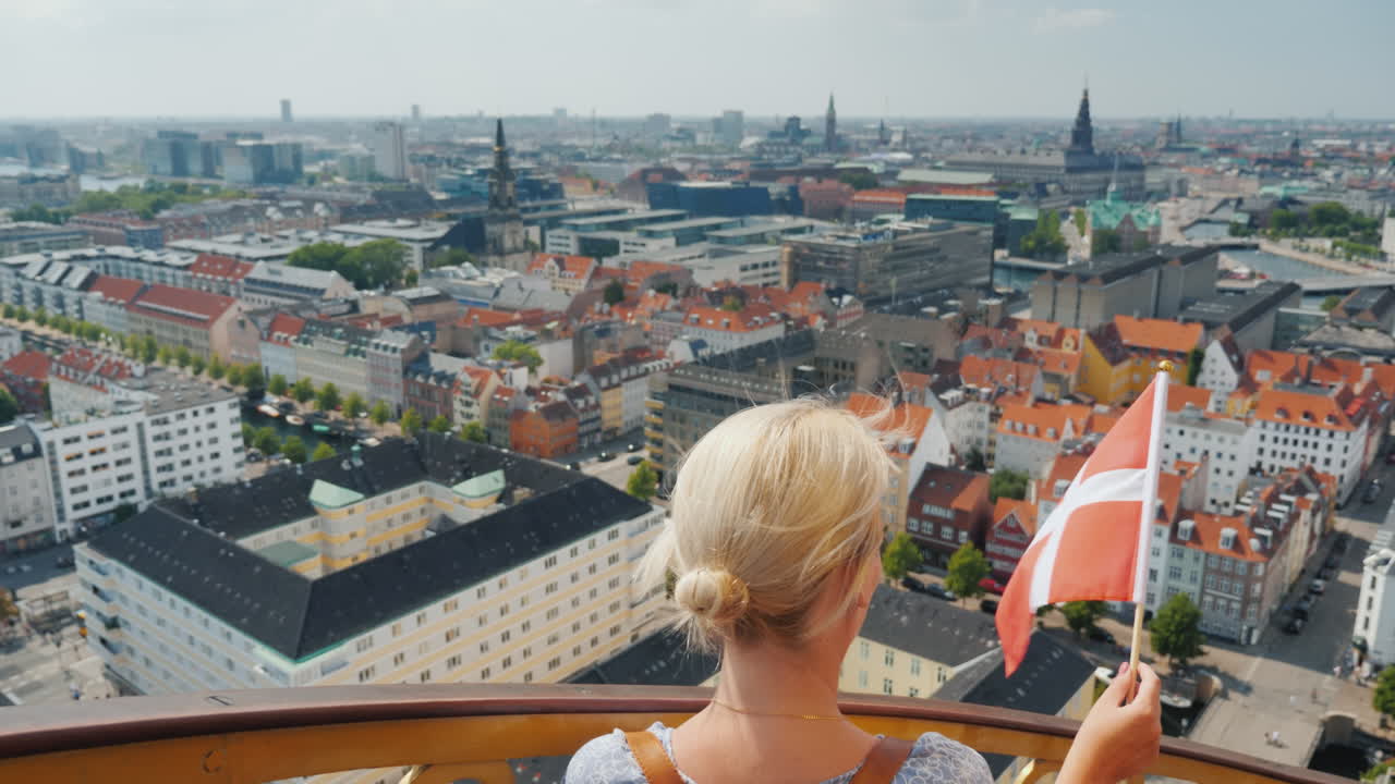 A Woman Descends From The Tower Through The Ancient Spiral Staircase Against The Background Of The C