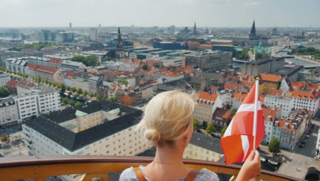 a woman descends from the tower through the ancient spiral staircase against the background of the c