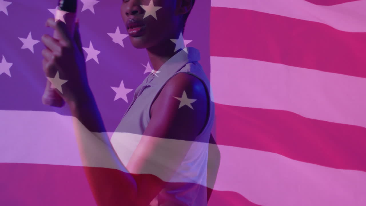 studio camera capturing woman standing in profile projecting stars stripes for graphic design