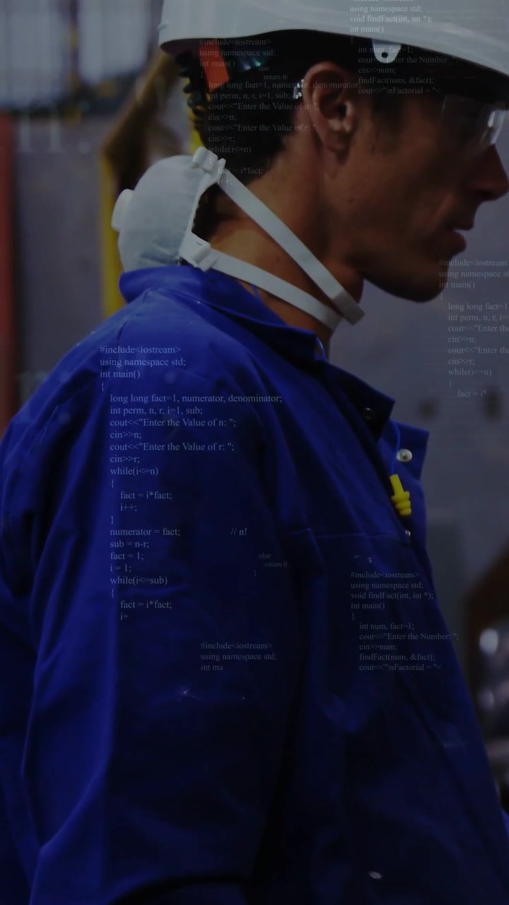 Vertical video: Factory worker moving across floor shift causing UI overlay showing mask for safety