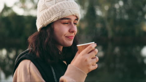 Face,-smile-and-hiking-with-a-woman-drinking