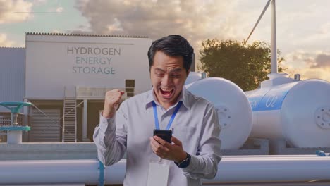 excited businessman at hydrogen energy storage facility