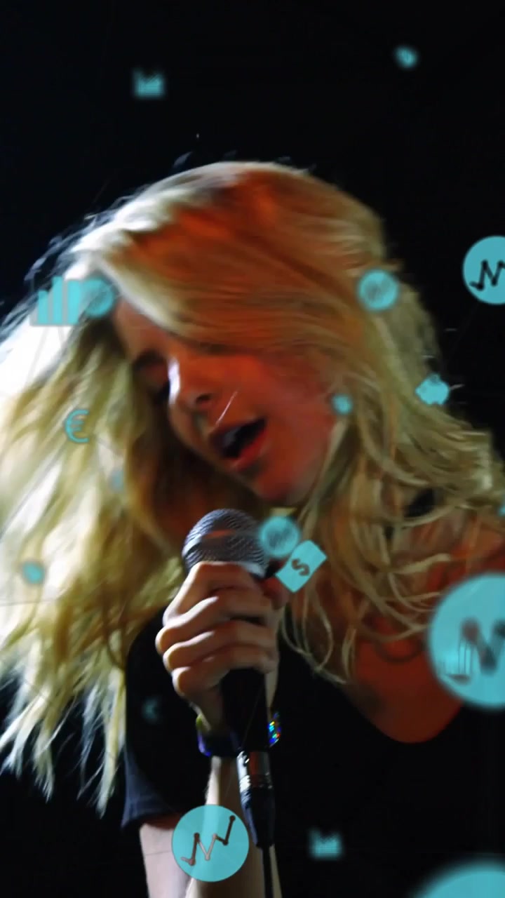 Vertical video: Lead singer gripping wired mic in club, causing teal finance icons obscuring faces
