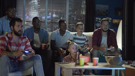 friends watching a game at home
