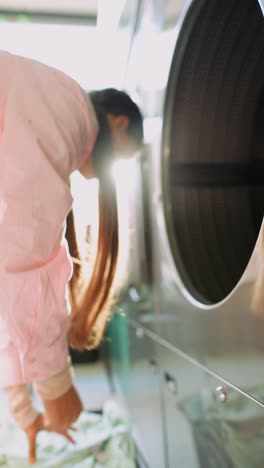 Woman Working in a Laundromat