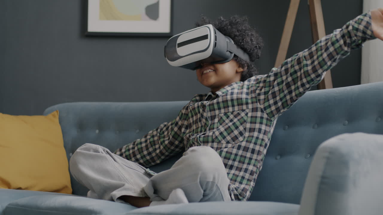 Child Playing VR Game on a Couch