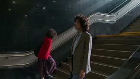 woman walking down stairs in a subway station