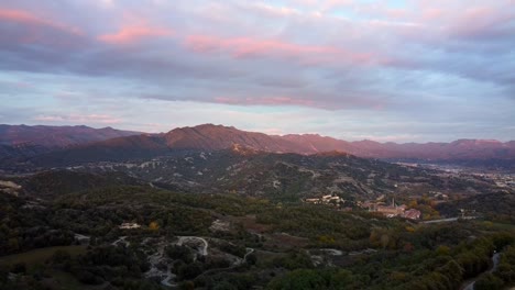 drone view of a pyrenean valley with small towns in sunset