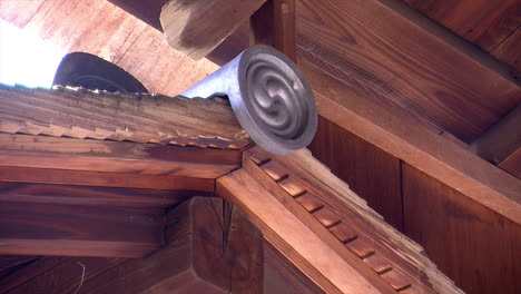 tile ornamentation at the peak of a hinoki wood roof on a japanese house