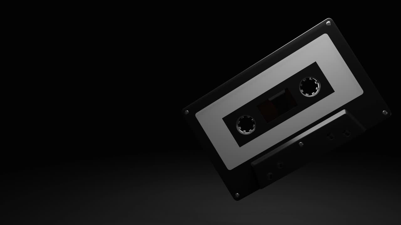 cinta de cassette negra aislada en un espacio de texto negro.