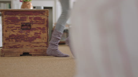 close up feet happy woman dancing at home having fun celebrating weekend morning with funky dance moves wearing socks enjoying freedom 4k footage