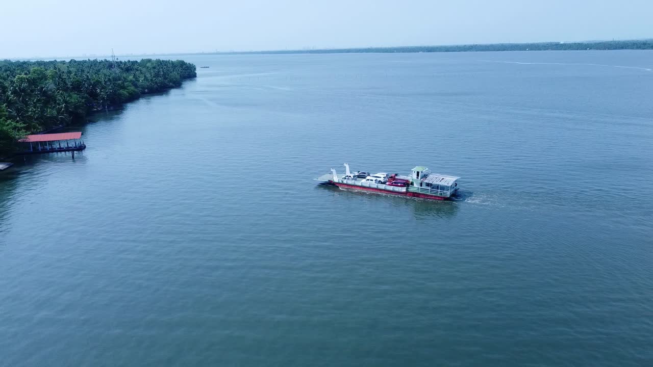 Arial view of Perumbalam Island village and ferry boat service, Alapuzha, Kerala,India, boat jetty, bridge, Vembanadu lake ,Sky, blue lake , Morning view.