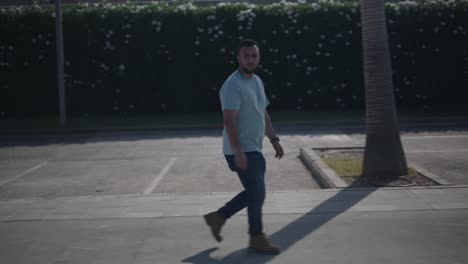 man walking in parking lot