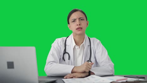 Angry-Indian-female-doctor-shouting-on-the-patient-Green-screen