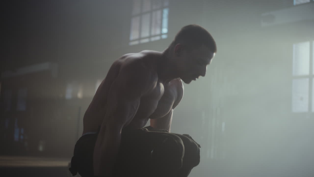 Man Performing Calisthenics Exercises in a Gym
