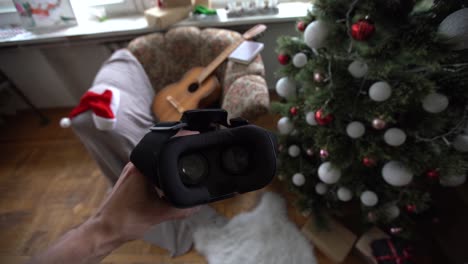 virtual glasses and a joystick in front of a christmas tree