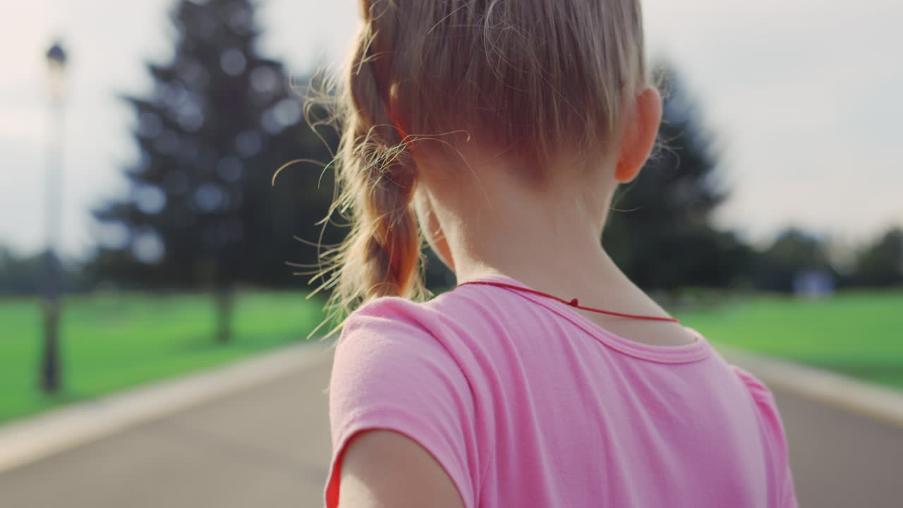 Happy family walking in city park