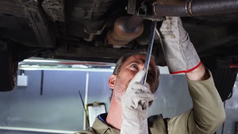 mechanic servicing a car