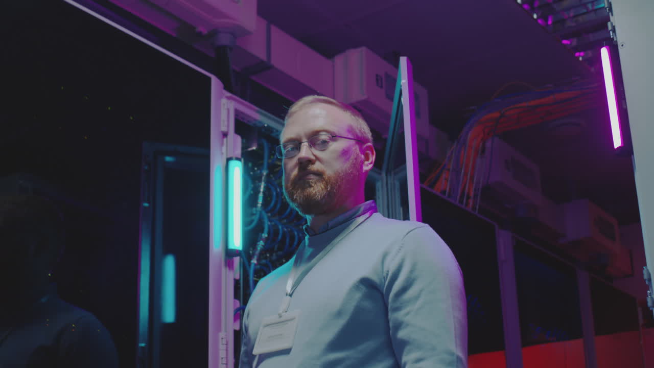 IT Professional in a Data Center with Neon Lights
