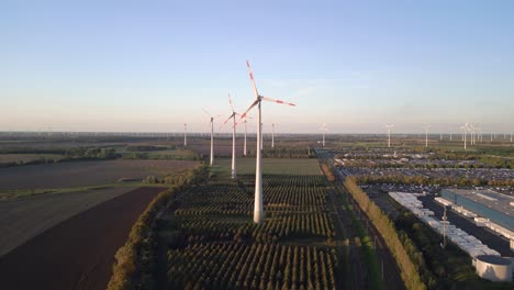 nice aerial view flight hovering drone of a wind turbine wheel field at brandenburg germany at summer day 2022