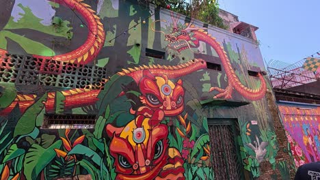 vivid street art and murals line the pedestrian walkways of seremban, malaysia. these artworks portray themes like culture, daily life, and history, reflecting the local community's essence.