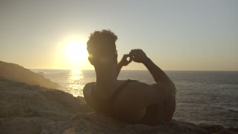 tranquil man resting seascape in summer at sunset