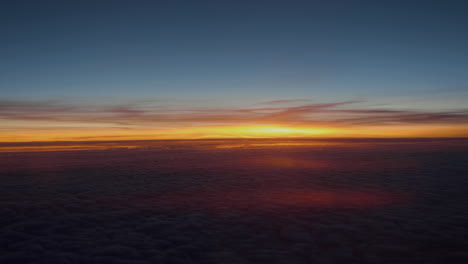 beautiful sunset above the clouds view from airplane