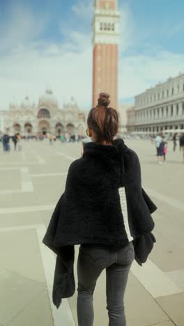 girl taking picture in st. mark's square, venice