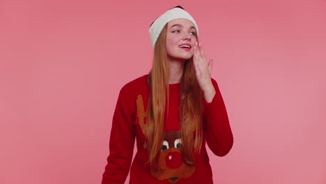 Girl-in-Christmas-sweater-sending-lots-of-air-kisses-looking-at-camera-and-smiling,-missing-you-love