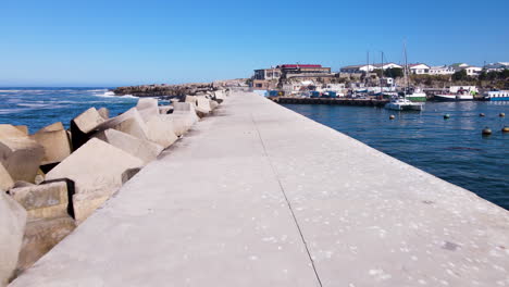 drone pullback riser from hermanus new harbour pier protected by dolosse