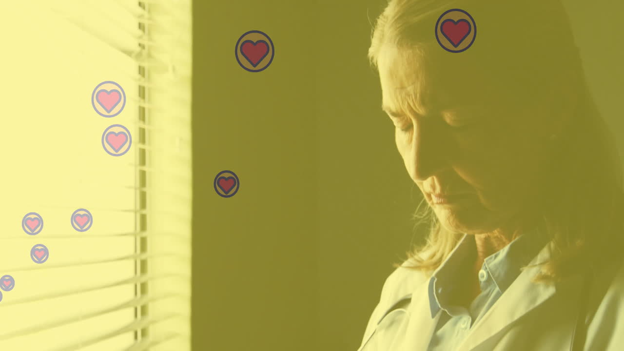 Heart icons floating around woman looking out window with animation effect
