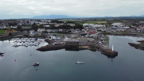 Aerial-view-of-Ardglass-harbour-and-town-on-a-cloudy-day,-County-Down,-Northern-Ireland