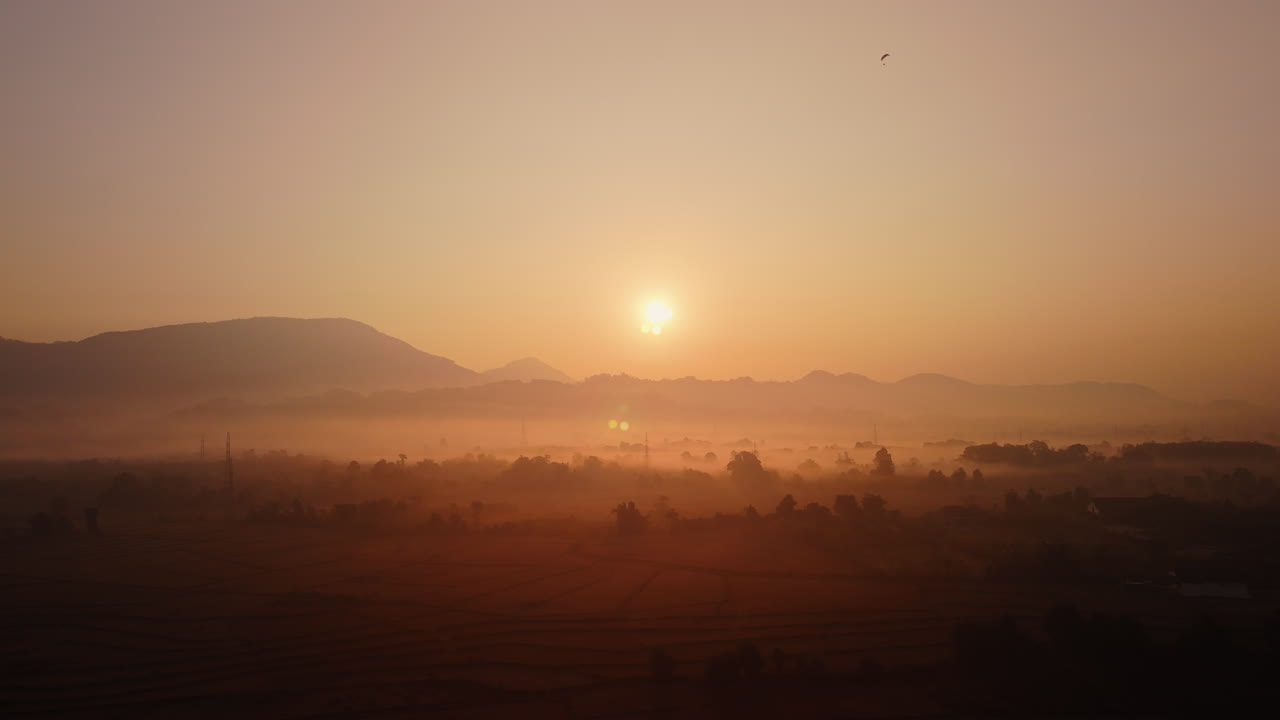 Misty Sunrise over the Mountains