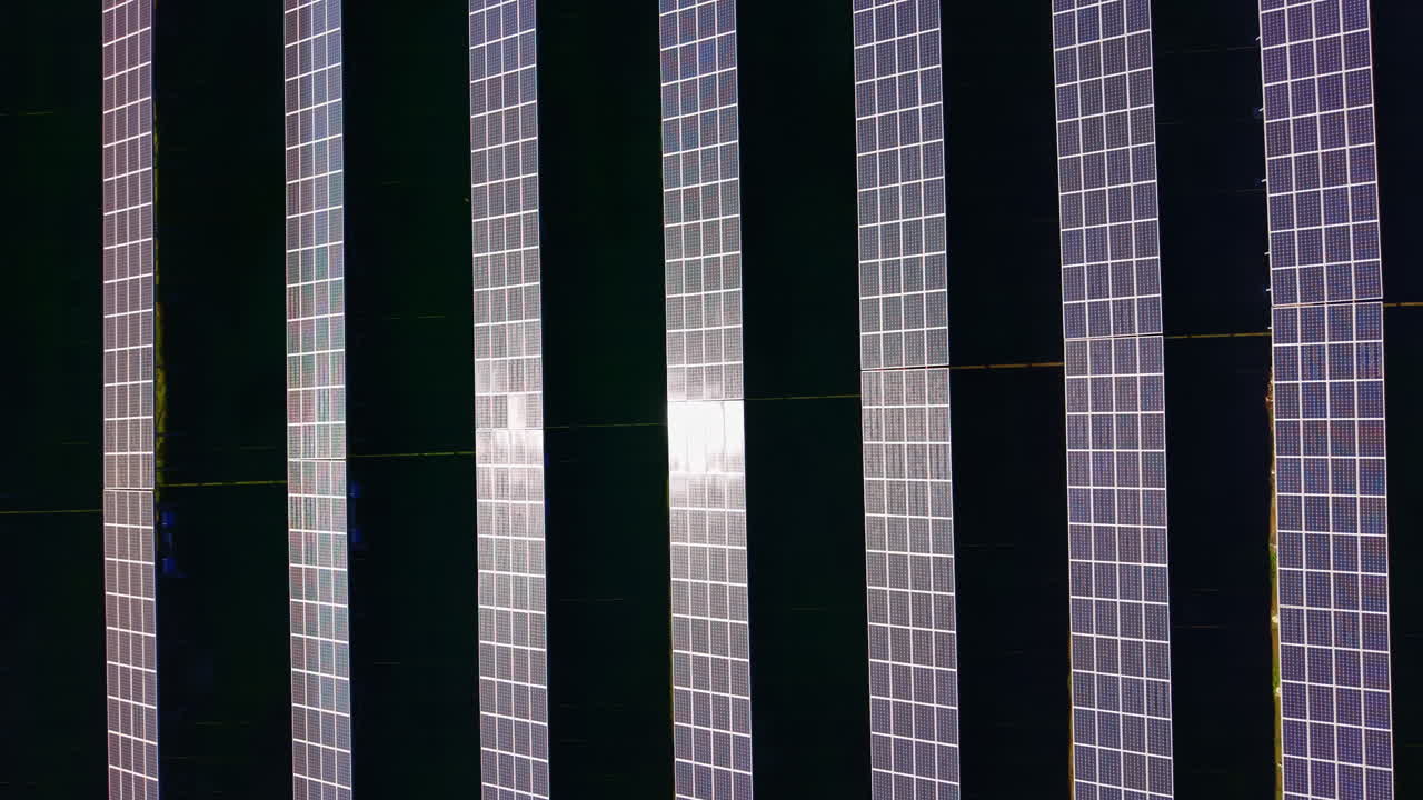 Solar panels installed on a roof capture sunlight during midday providing renewable energy for the building's electricity needs to reduce reliance on traditional power sources