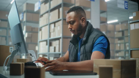 warehouse worker at computer