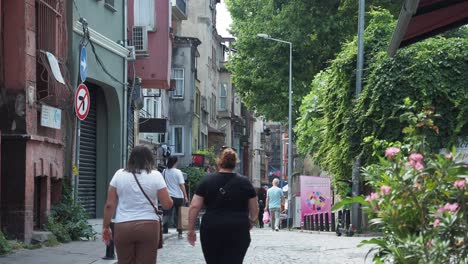 people walking down a narrow street in istanbul, turkey