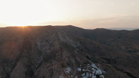 sunlight reflects on mountain slopes of serifos island, cyclades at sunset near chora hills