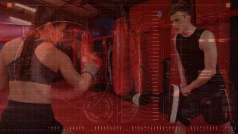 fitness trainer punching mitt held by male trainee in gym, with digital hud displaying data graphs